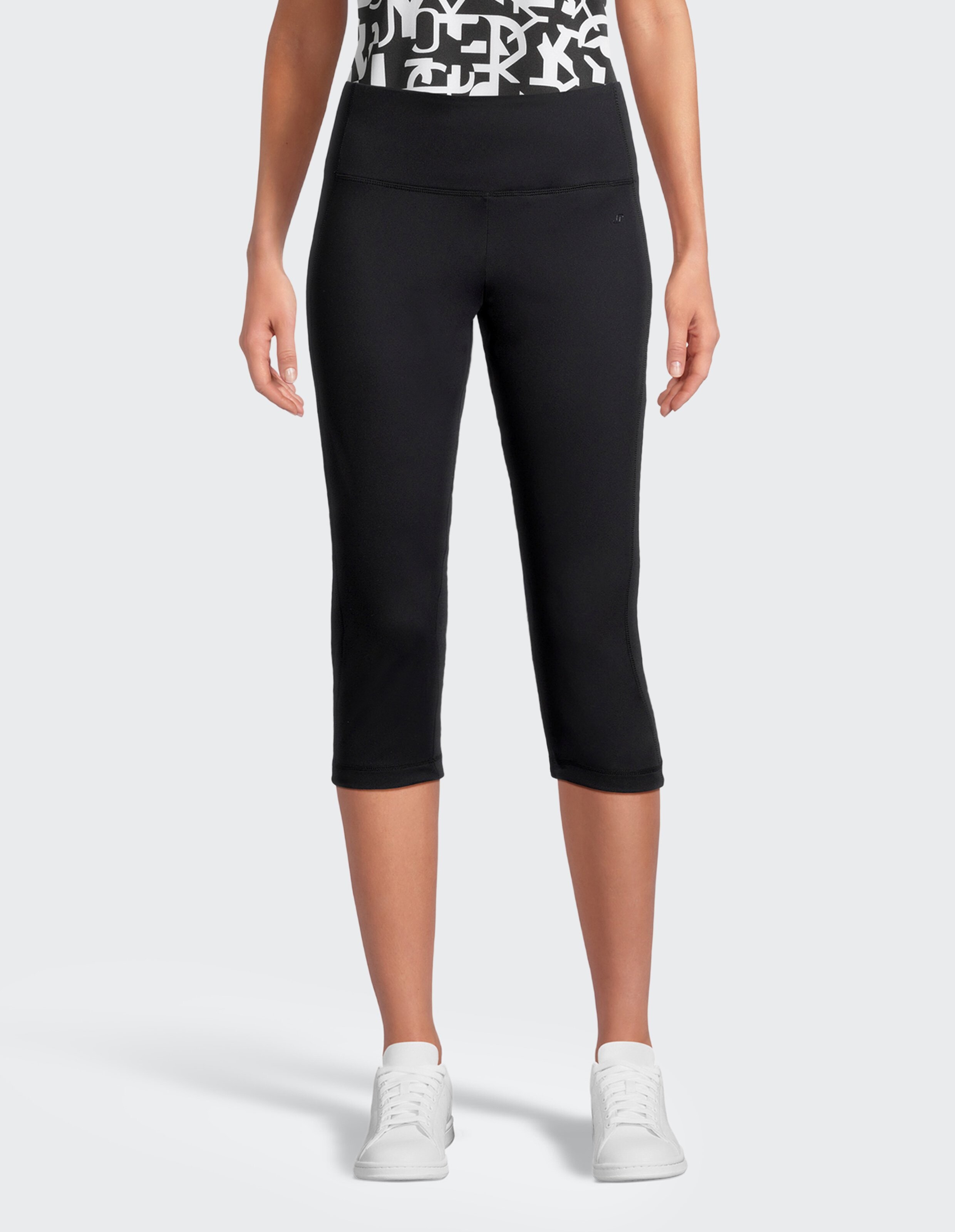 Schwarze, knielange Sportleggings mit breitem Bund und schmalem Schnitt, ideal für Fitnessaktivitäten und bequemes Tragen.