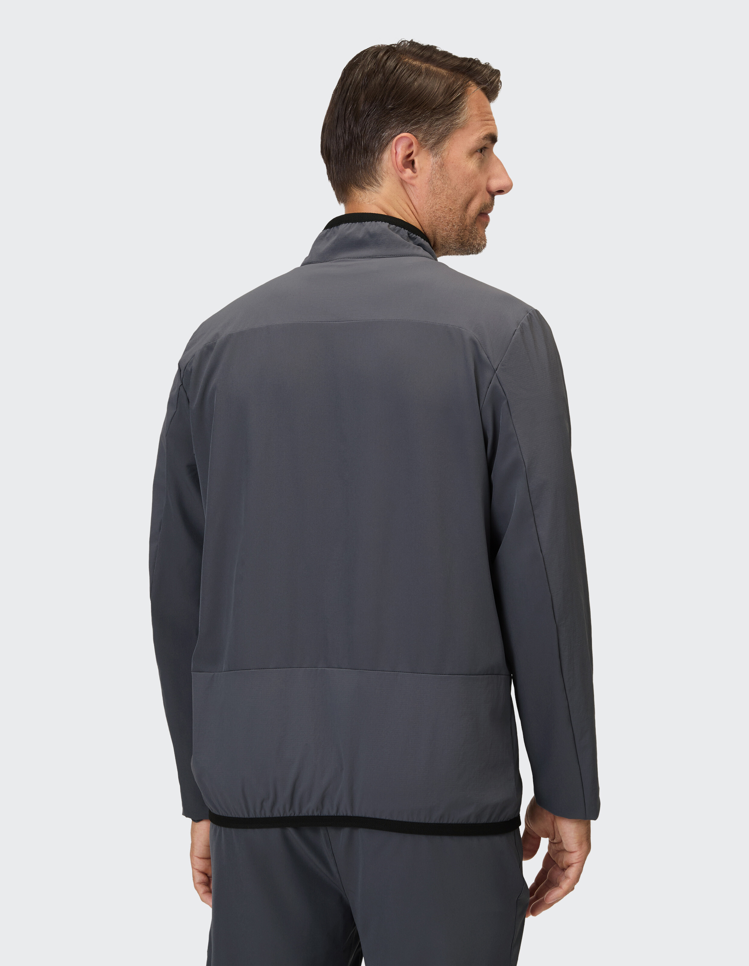 Dunkelgraue Trainingsjacke mit schwarzem Bund.