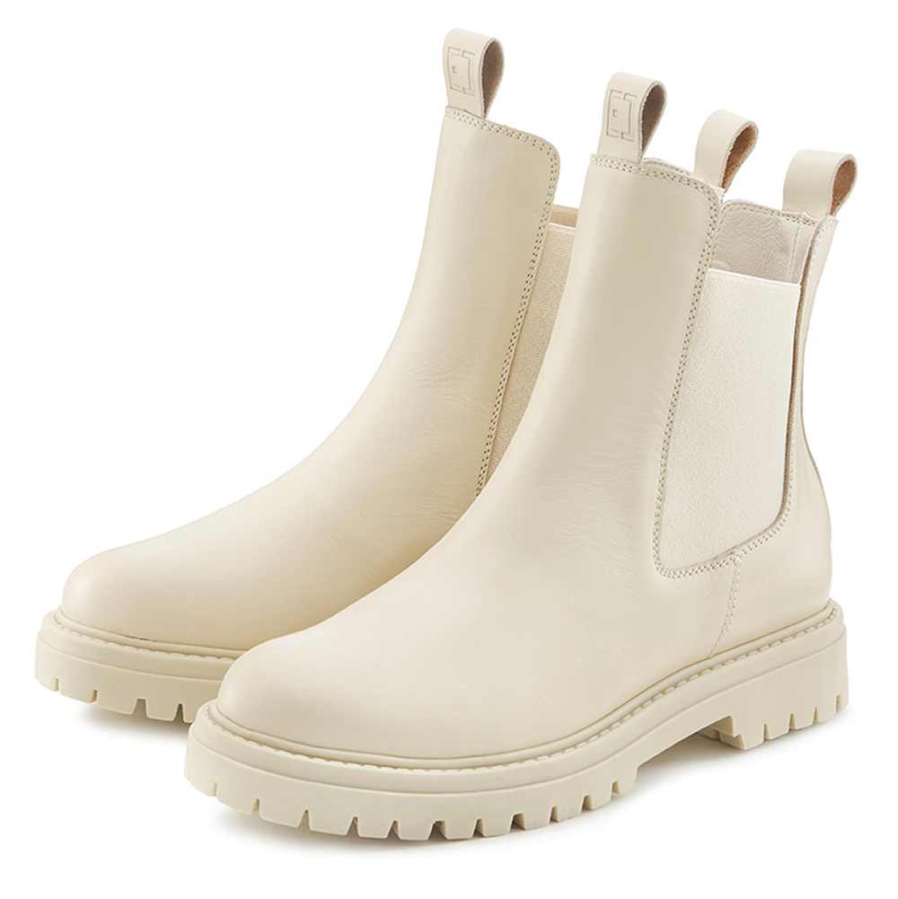 Stilvolle cremefarbene Chelsea-Stiefel mit dicker Sohle und elastischen Seiteneinsätzen.