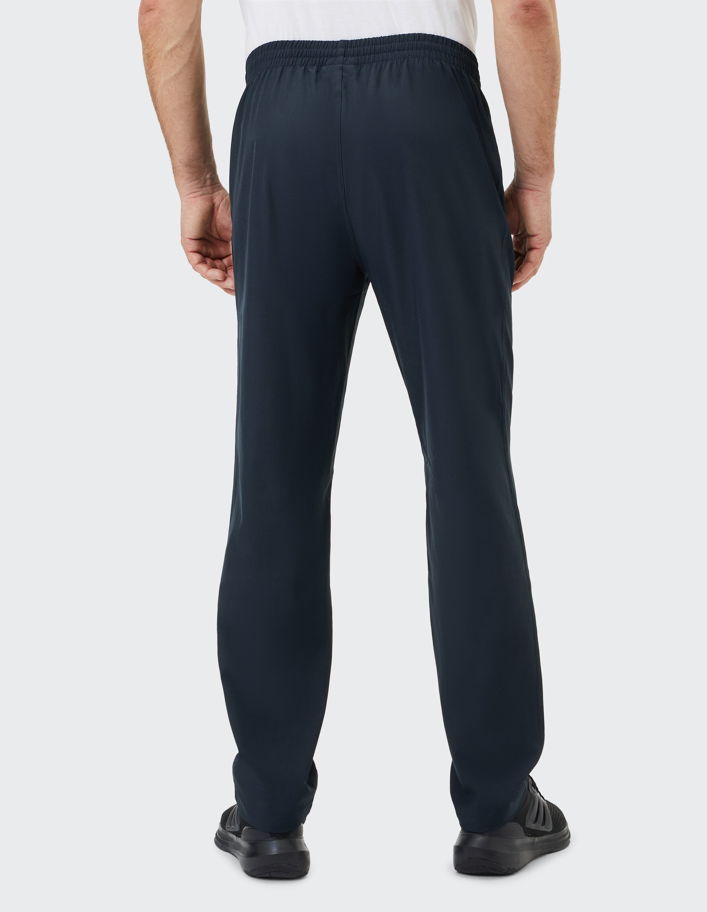 Dunkelblaue, locker sitzende Hose aus weichem Stoff mit elastischem Bund, knitterfrei und knöchellang, für einen lässigen Look.
