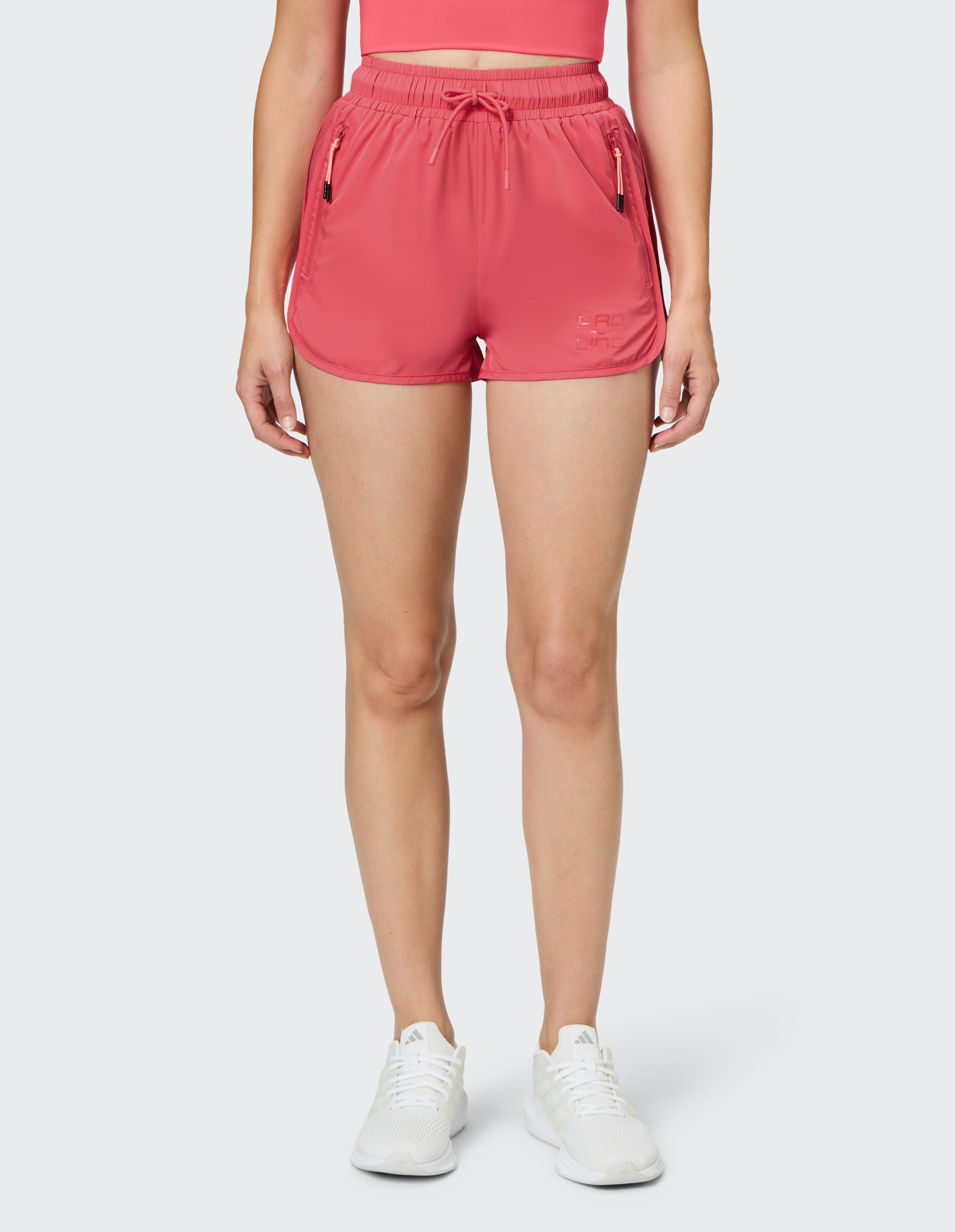 Rosa Sportshorts für Damen mit Taschen, perfekt für Freizeitkleidung und Workouts.