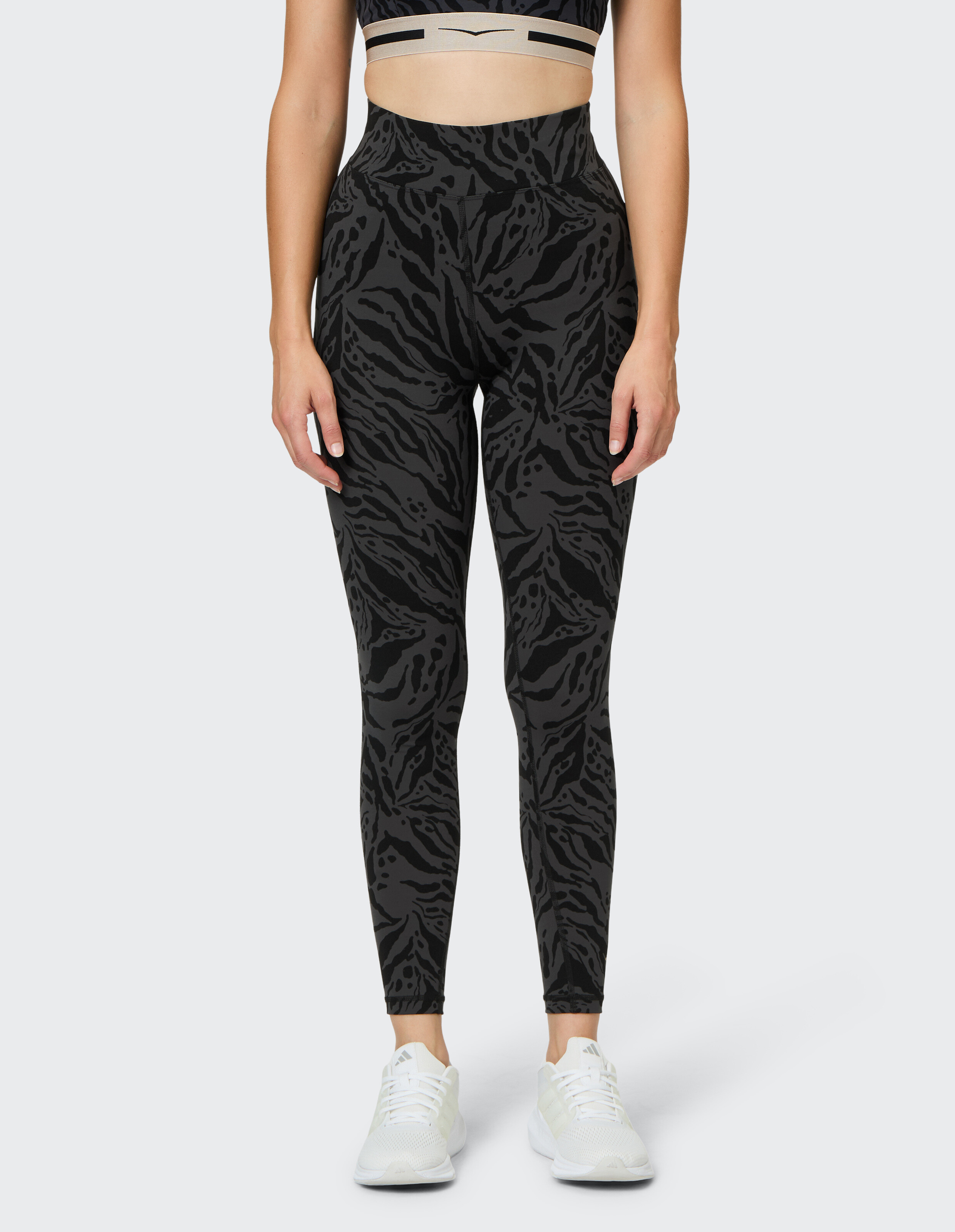 Schwarze Leggings mit hohem Bund und stilvollem Animal-Print-Muster, perfekt für Freizeitkleidung.