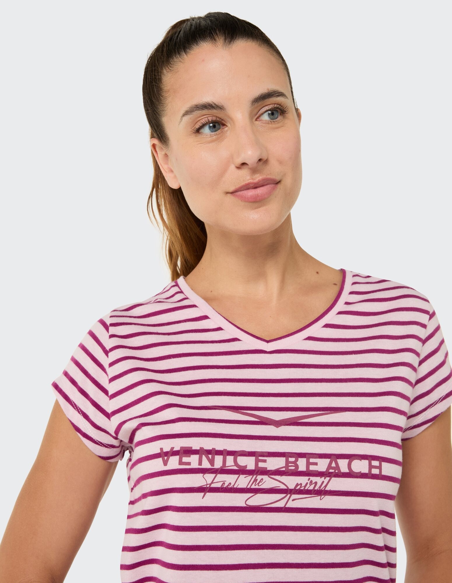 Gestreiftes Damen-T-Shirt mit V-Ausschnitt in Rosa und Weiß mit Venice Beach-Grafik.