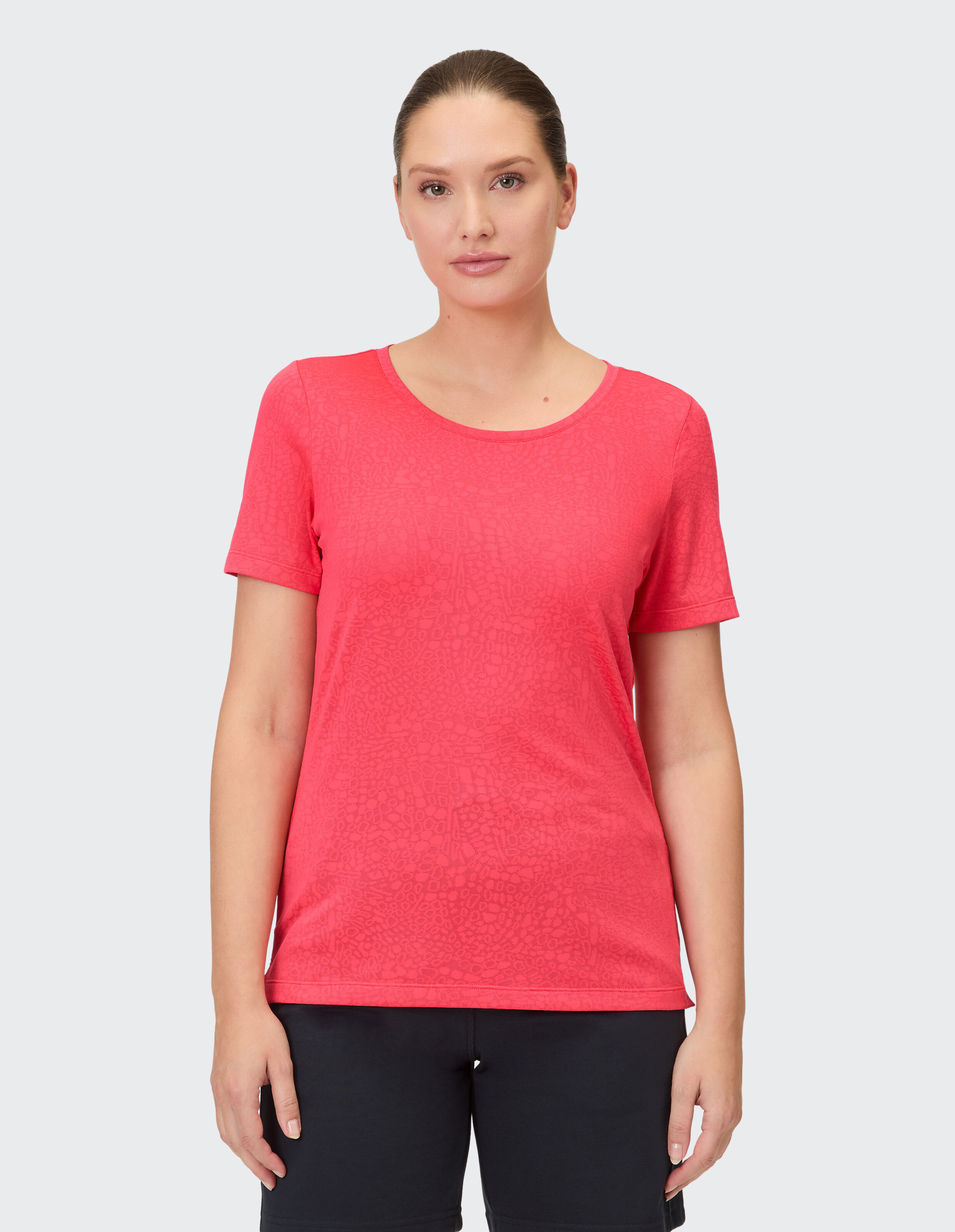 Kurzärmliges Damen-T-Shirt in Korallenrot mit dezentem Muster, perfekt für die Freizeit.