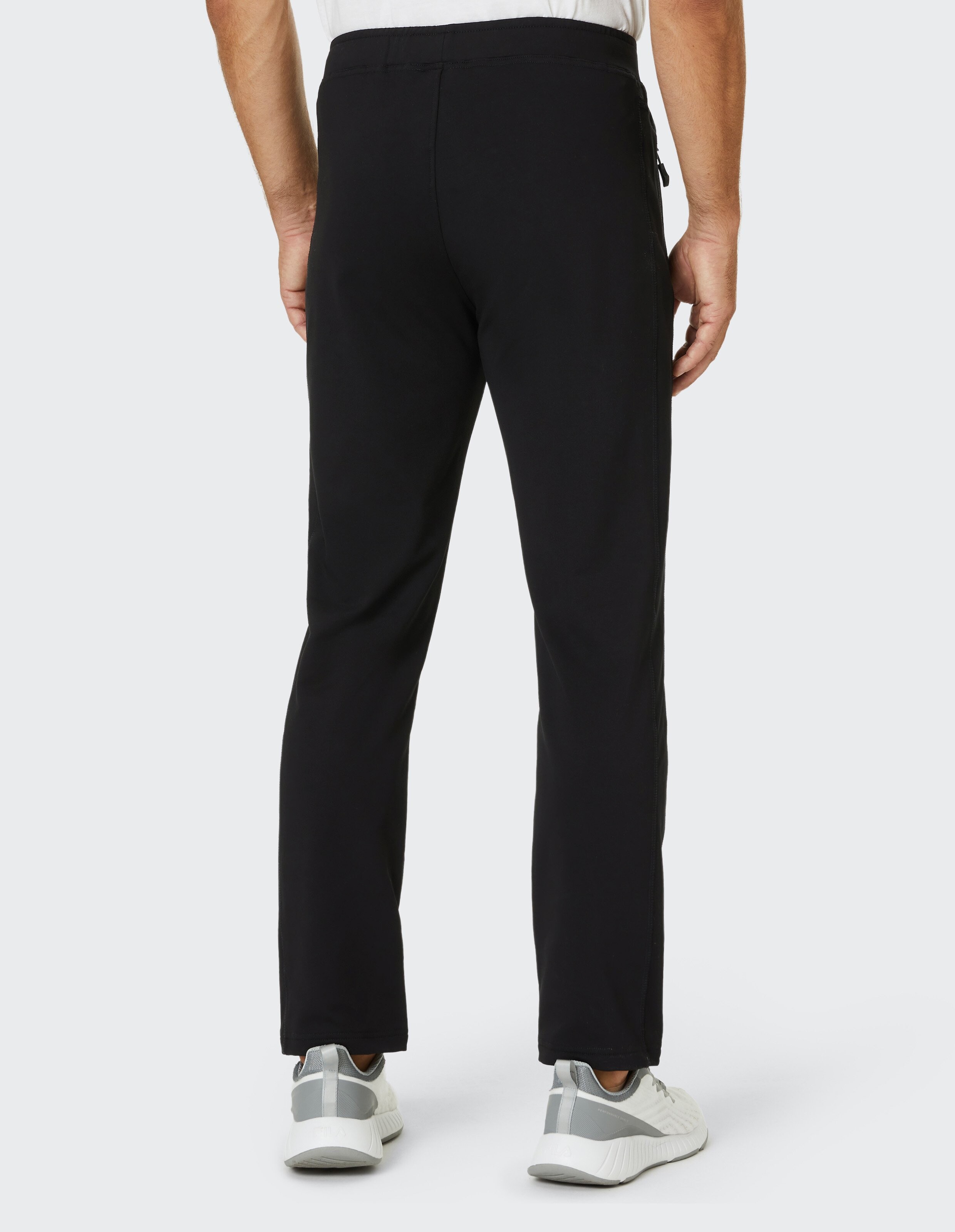Schwarze Jogginghose mit elastischem Bund und Reißverschlusstaschen an den Seiten, schlichtes Design und bequemer Schnitt.