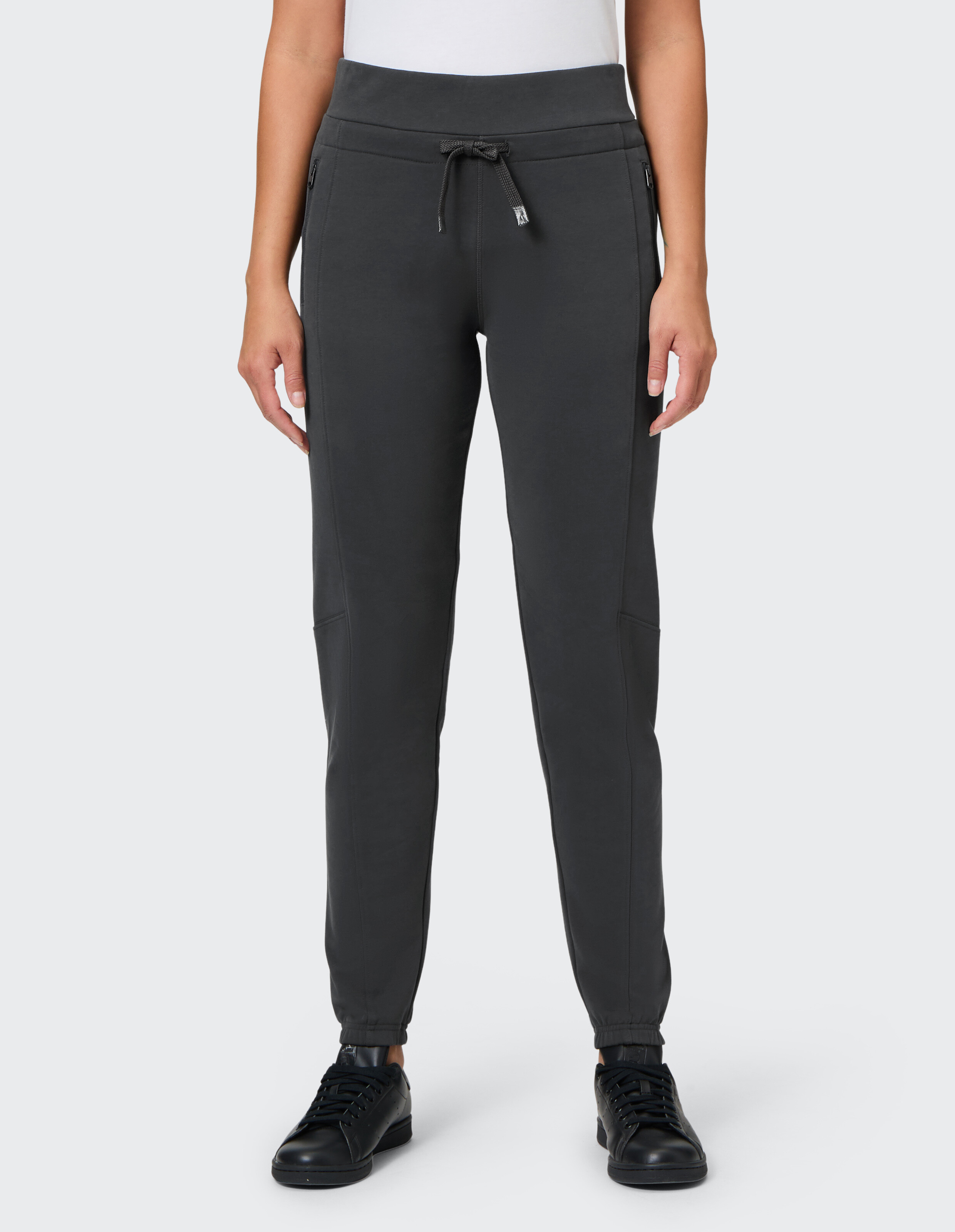 Dunkelgraue Jogginghose für Damen mit Kordelzug in der Taille und Seitentaschen, perfekt für Freizeitkleidung und zum Faulenzen.