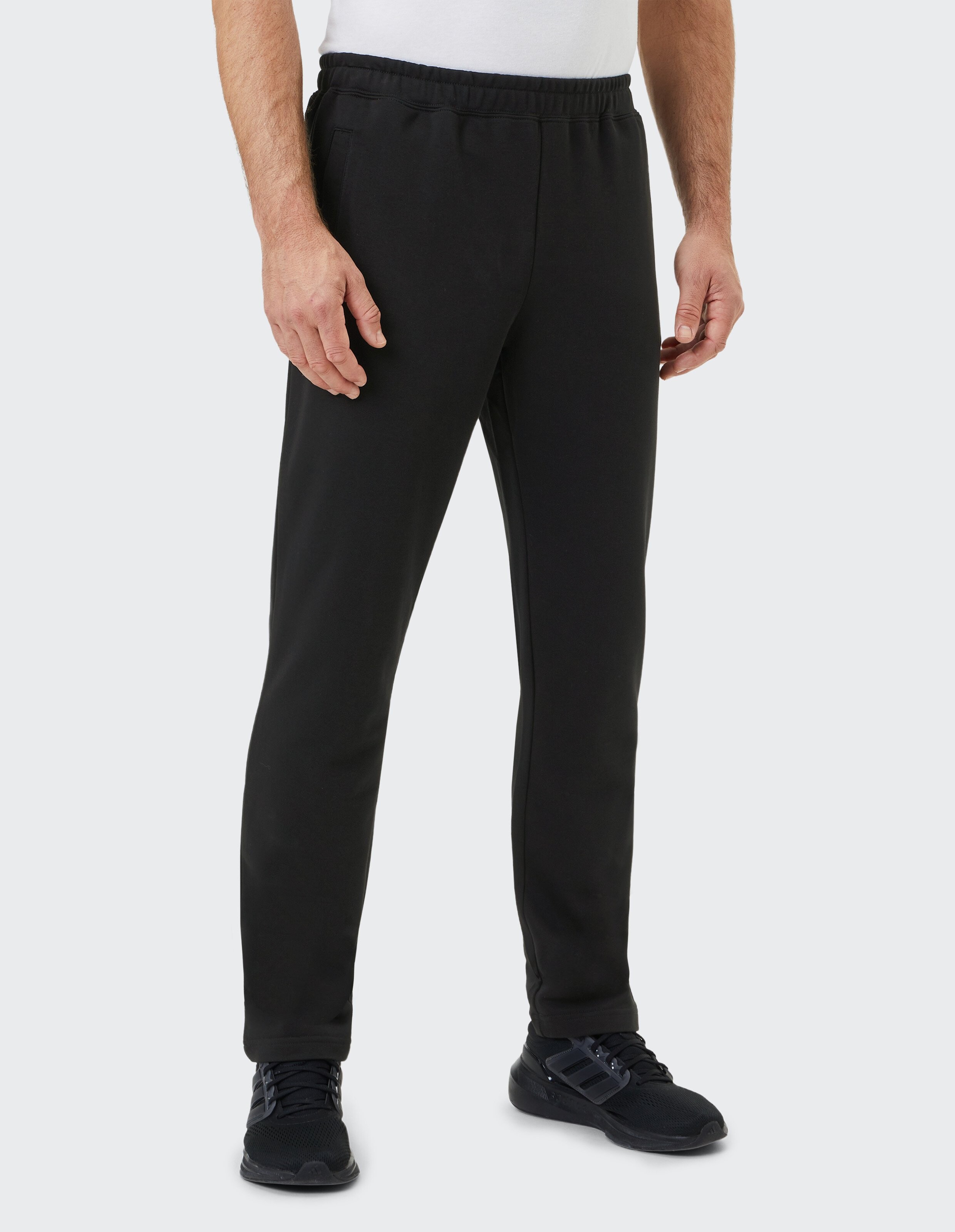 Schwarze Jogginghose mit elastischem Bund und geradem Schnitt, aus weichem Material, ideal für Komfort und Bewegungsfreiheit.