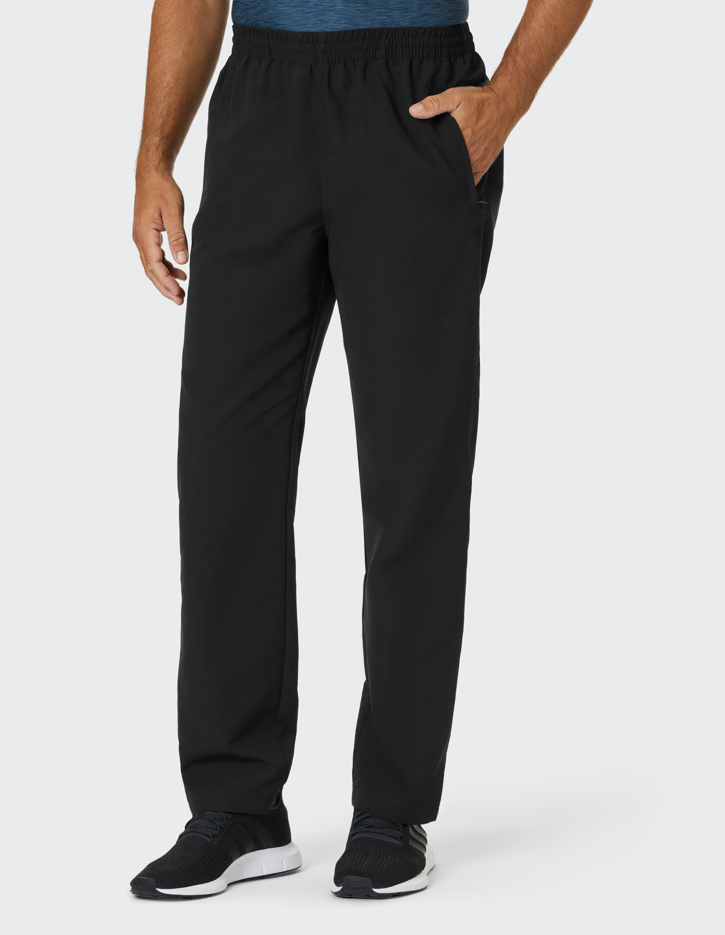 Schwarze, gerade geschnittene Hose mit elastischem Bund und seitlichen Taschen, ideal für Freizeitkleidung.