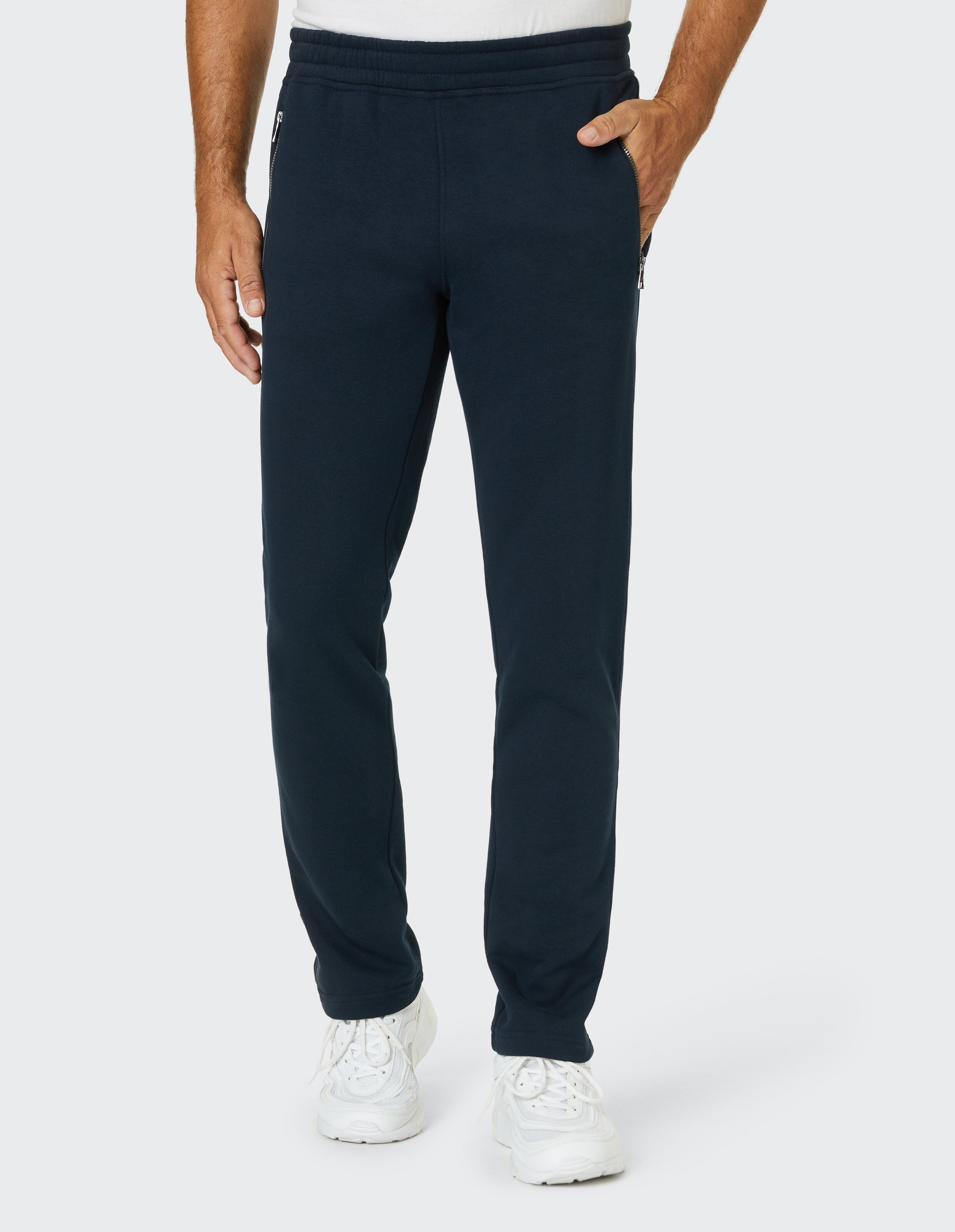 Dunkelblaue Jogginghose mit elastischem Bund und seitlichen Reißverschlusstaschen für bequemen und sportlichen Stil.