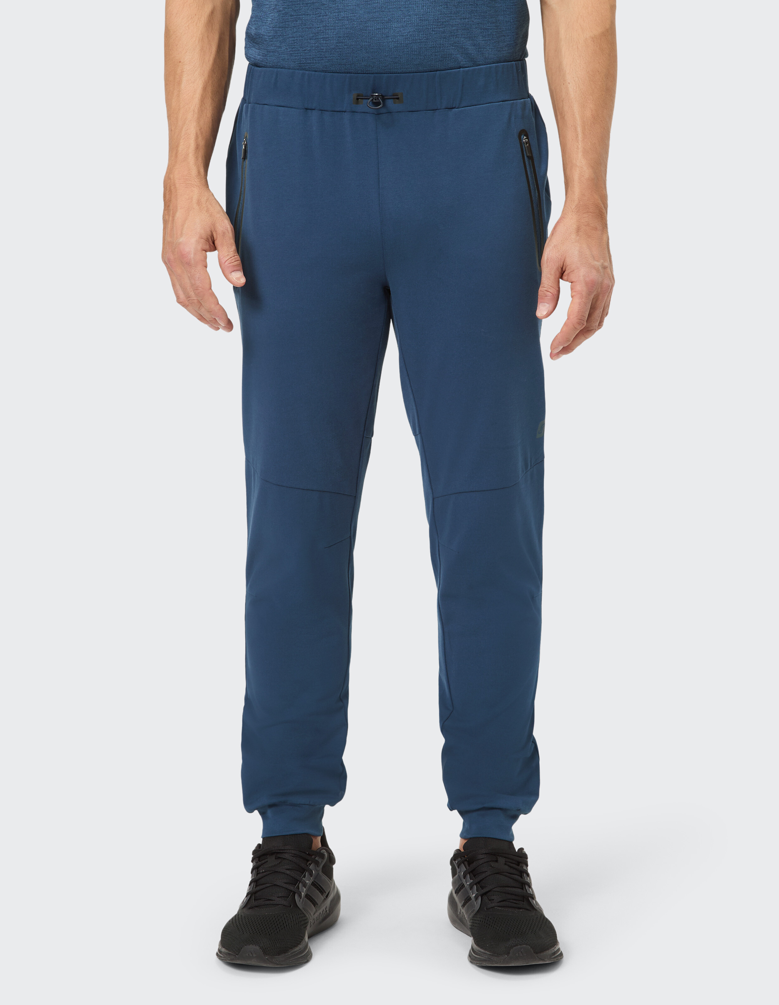 Marineblaue Herren-Jogginghose mit Reißverschlusstaschen, perfekt für den Freizeitgebrauch.