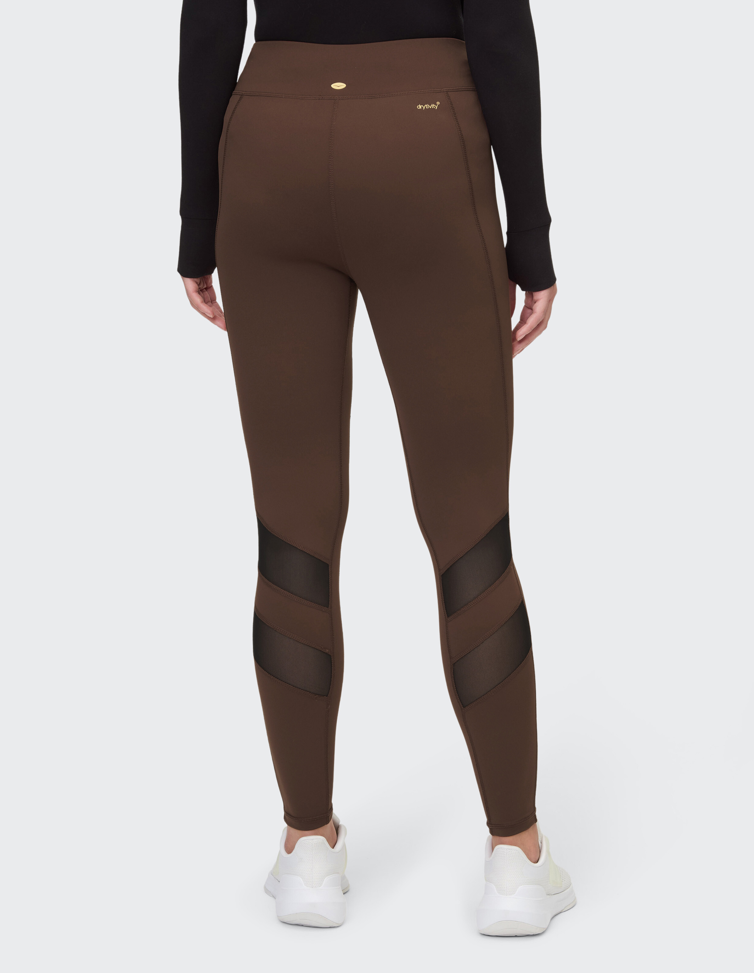 Braune Leggings mit hoher Taille und Mesh-Einsätzen, perfekt für Freizeitkleidung.