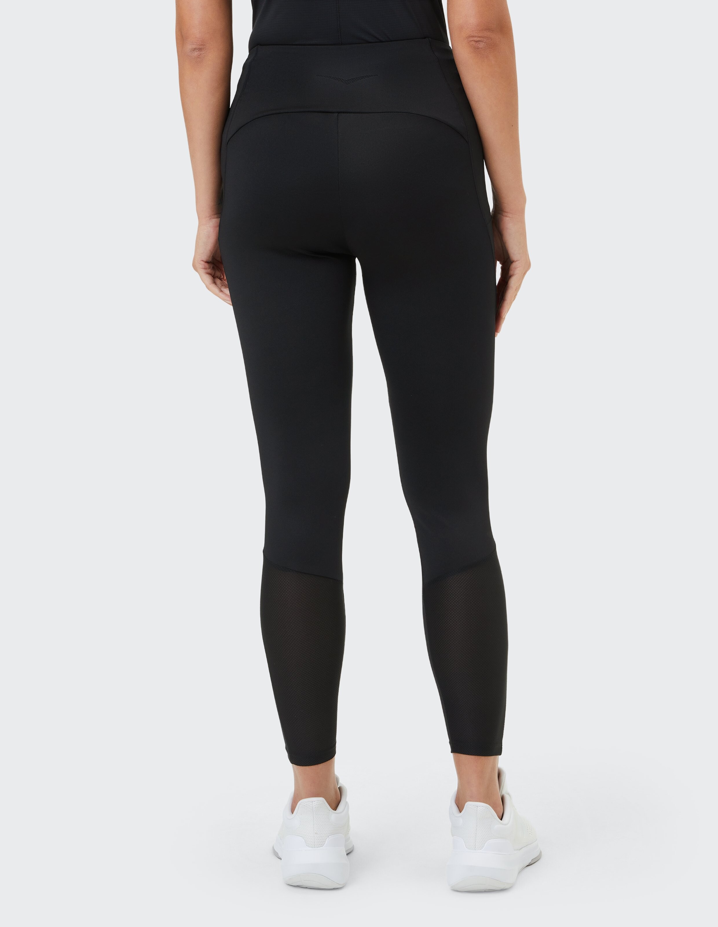 Schwarze Leggings mit Mesh-Einsätzen, perfekt für Freizeitkleidung und einen aktiven Lebensstil.