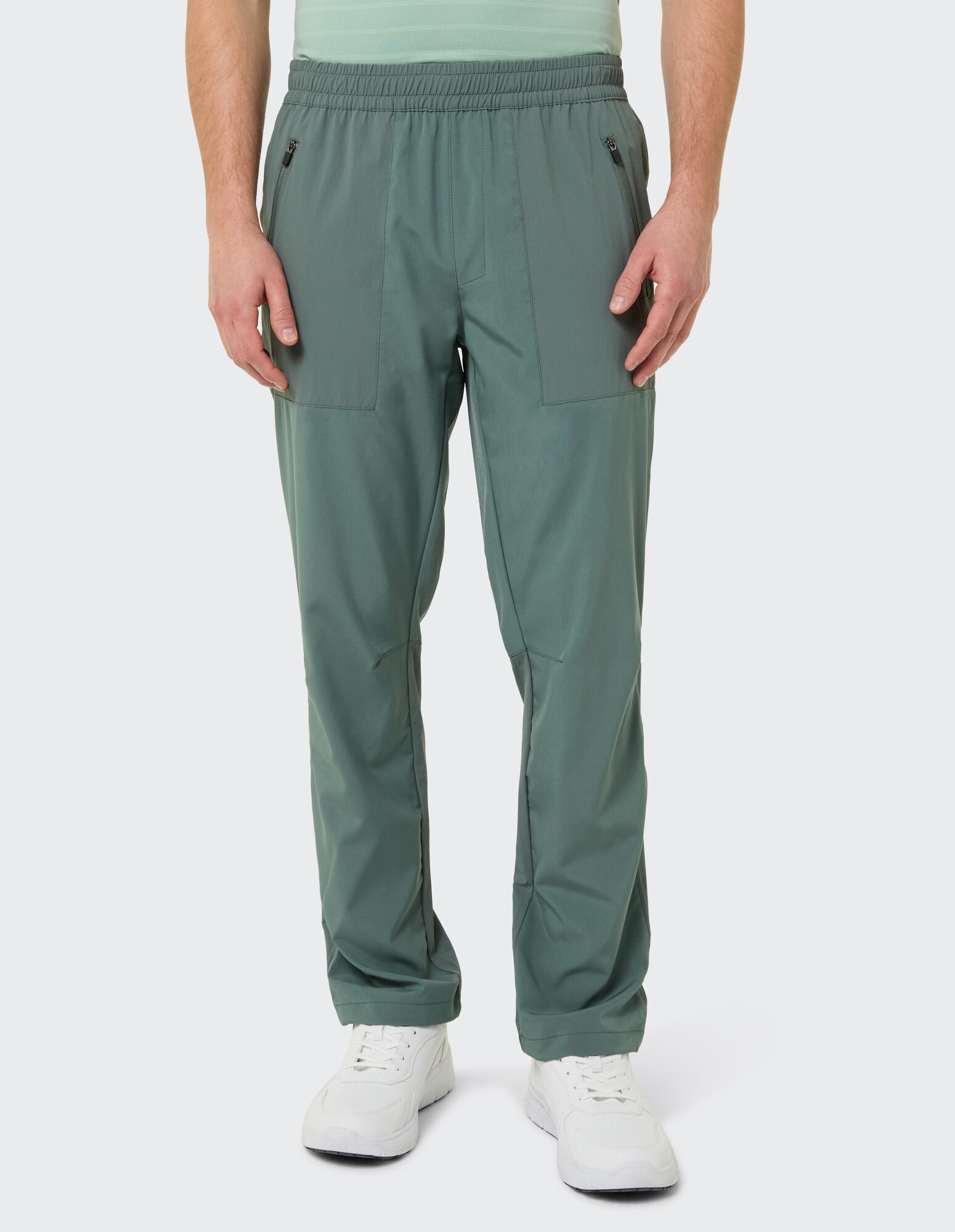 Grüne Freizeithose für Herren mit elastischem Bund und Seitentaschen.