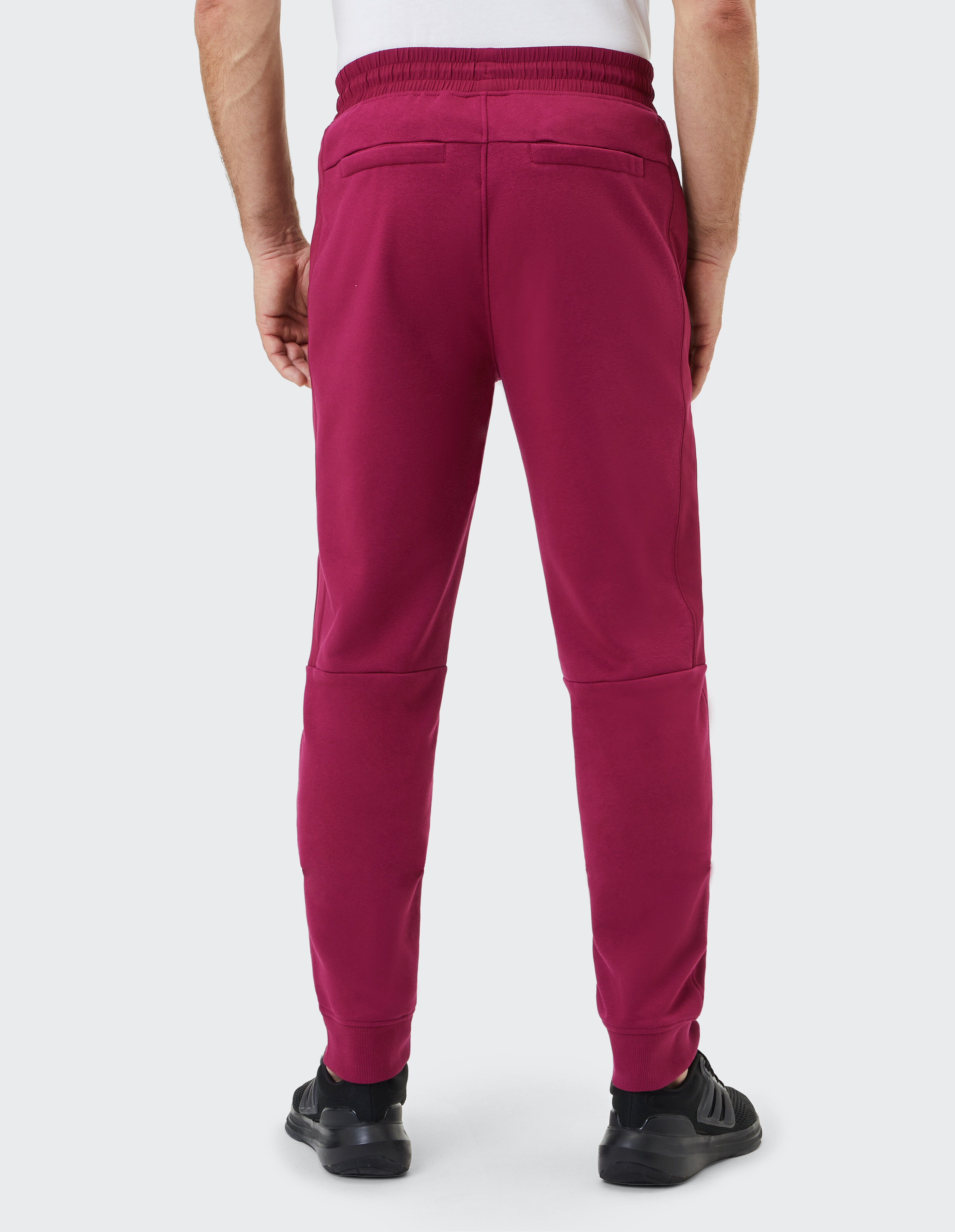 Bordeauxrote Jogginghose mit Kordelzug, elastischem Bund und Seitentaschen, geeignet für Freizeit und Sport.