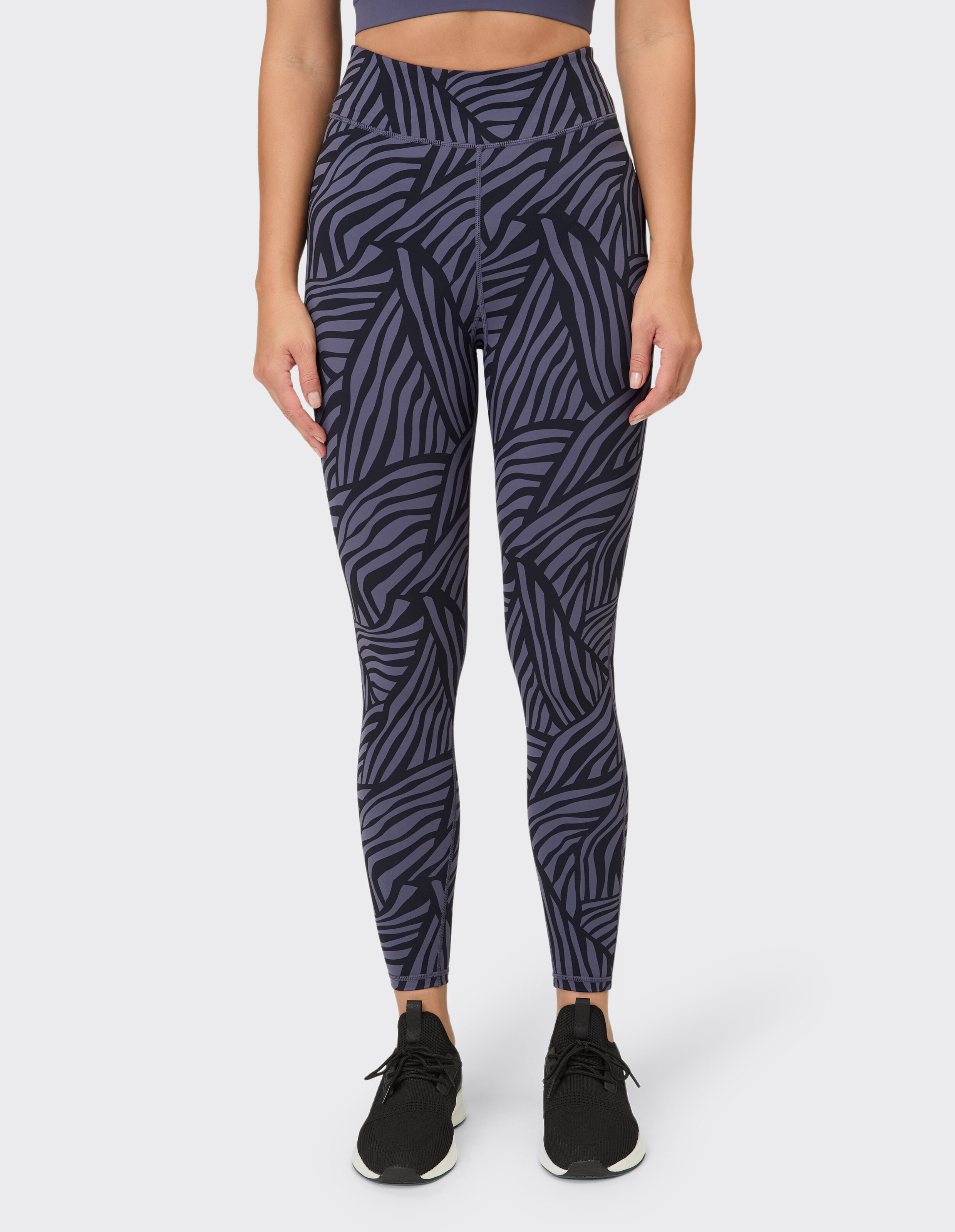 Leggings mit hohem Bund und abstraktem Muster in Lila, ideal für Freizeitkleidung.