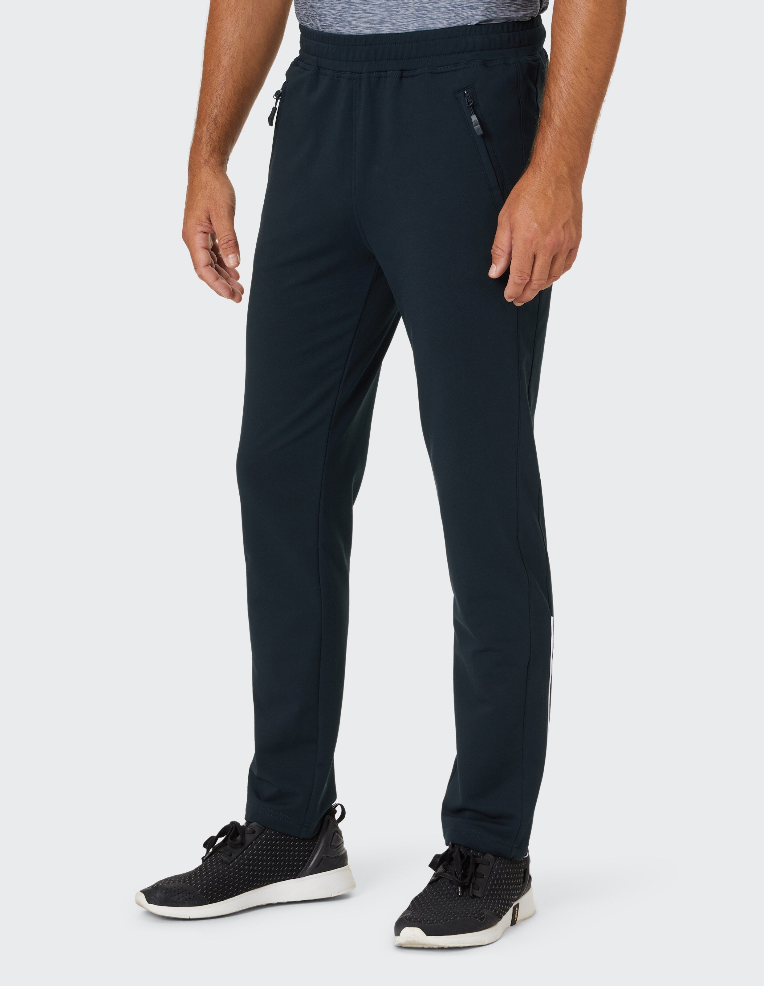 Dunkelblaue Jogginghose mit geradem Schnitt, elastischem Bund und zwei seitlichen Reißverschlusstaschen auf weißem Hintergrund.