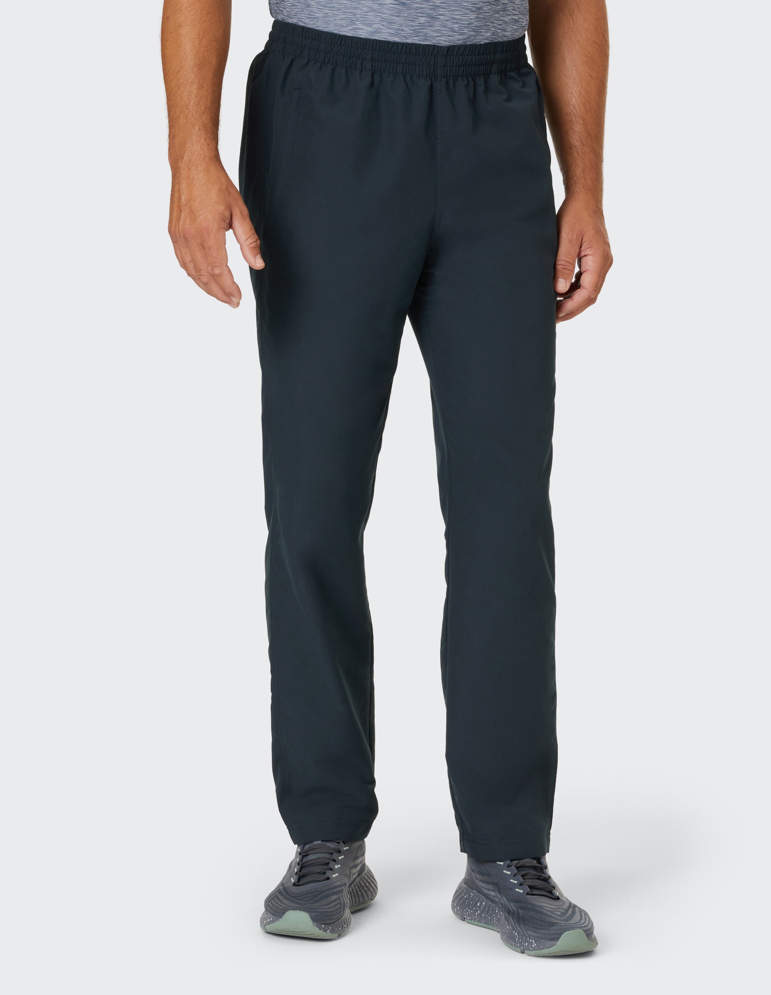 Dunkelblaue Jogginghose mit elastischem Bund und weitem Bein, eignet sich für Fitness oder Freizeitaktivitäten.