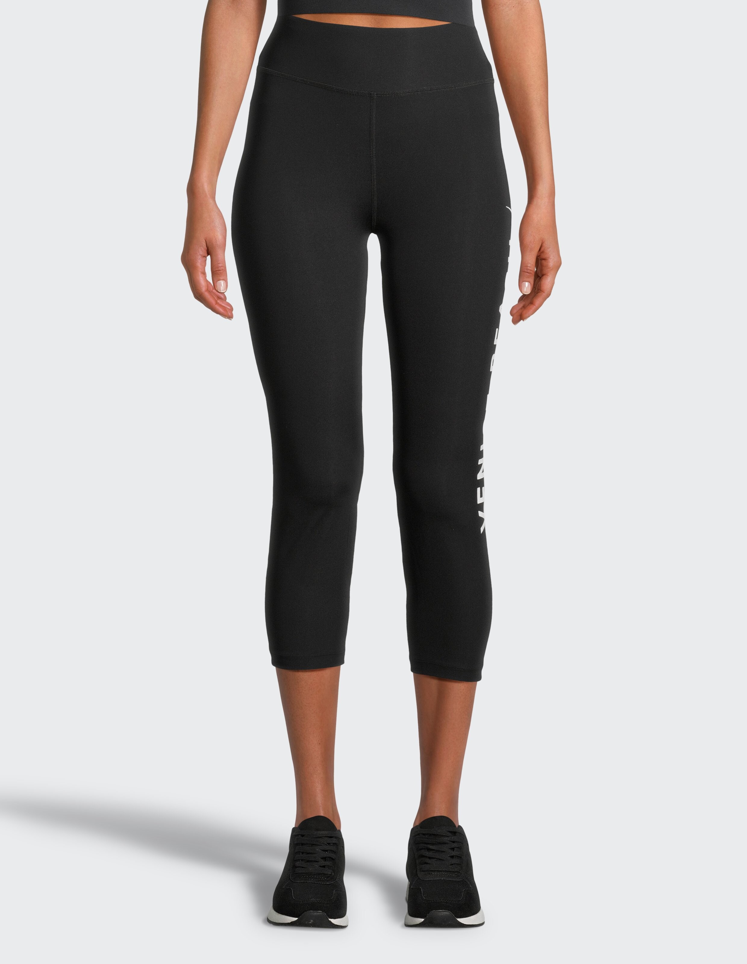 Schwarze, verkürzte Leggings mit hoher Taille und seitlichem Logo-Detail, perfekt für Freizeitkleidung.