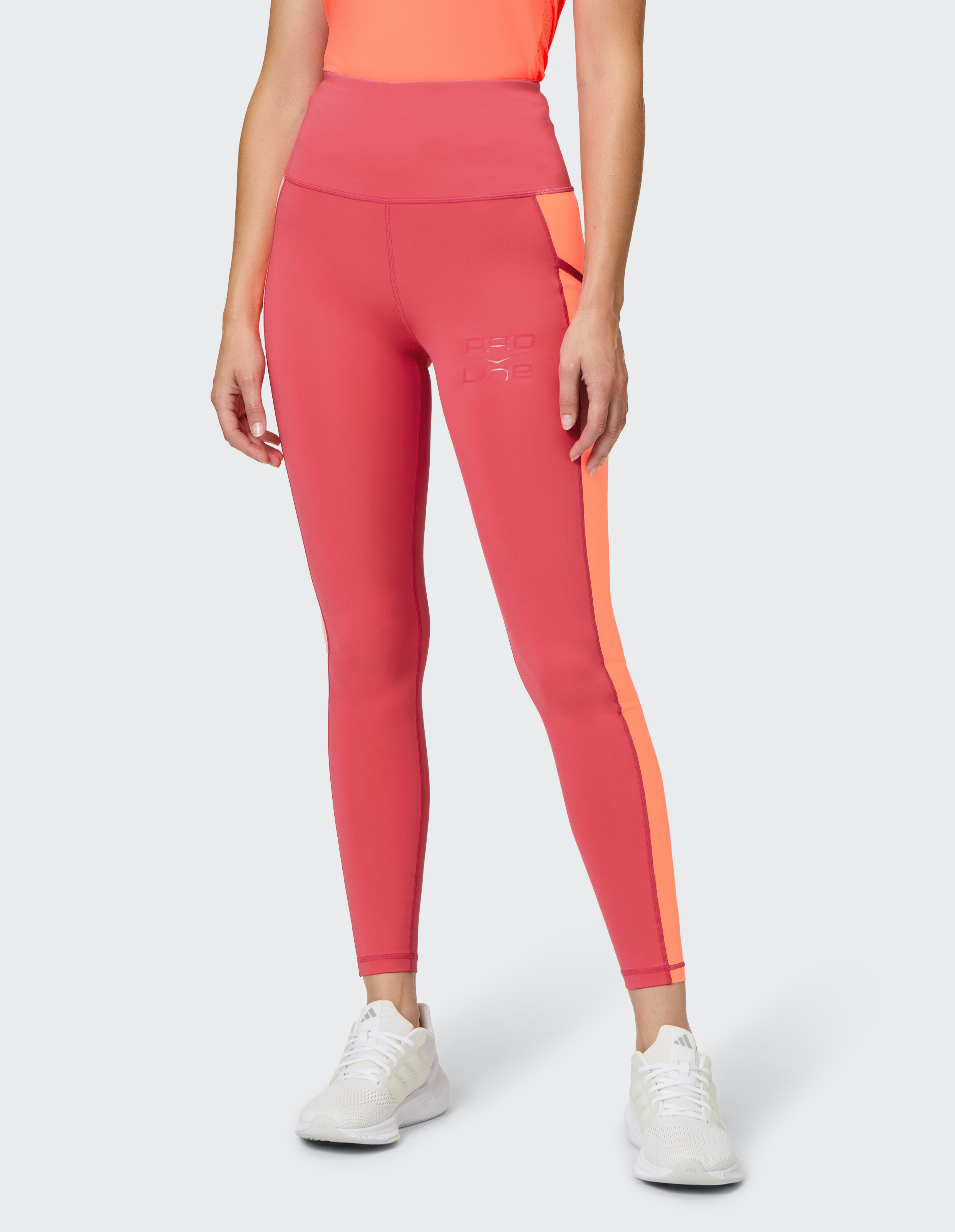 Stylische Leggings mit hohem Bund in Pink und Orange, perfekt für Freizeitkleidung.
