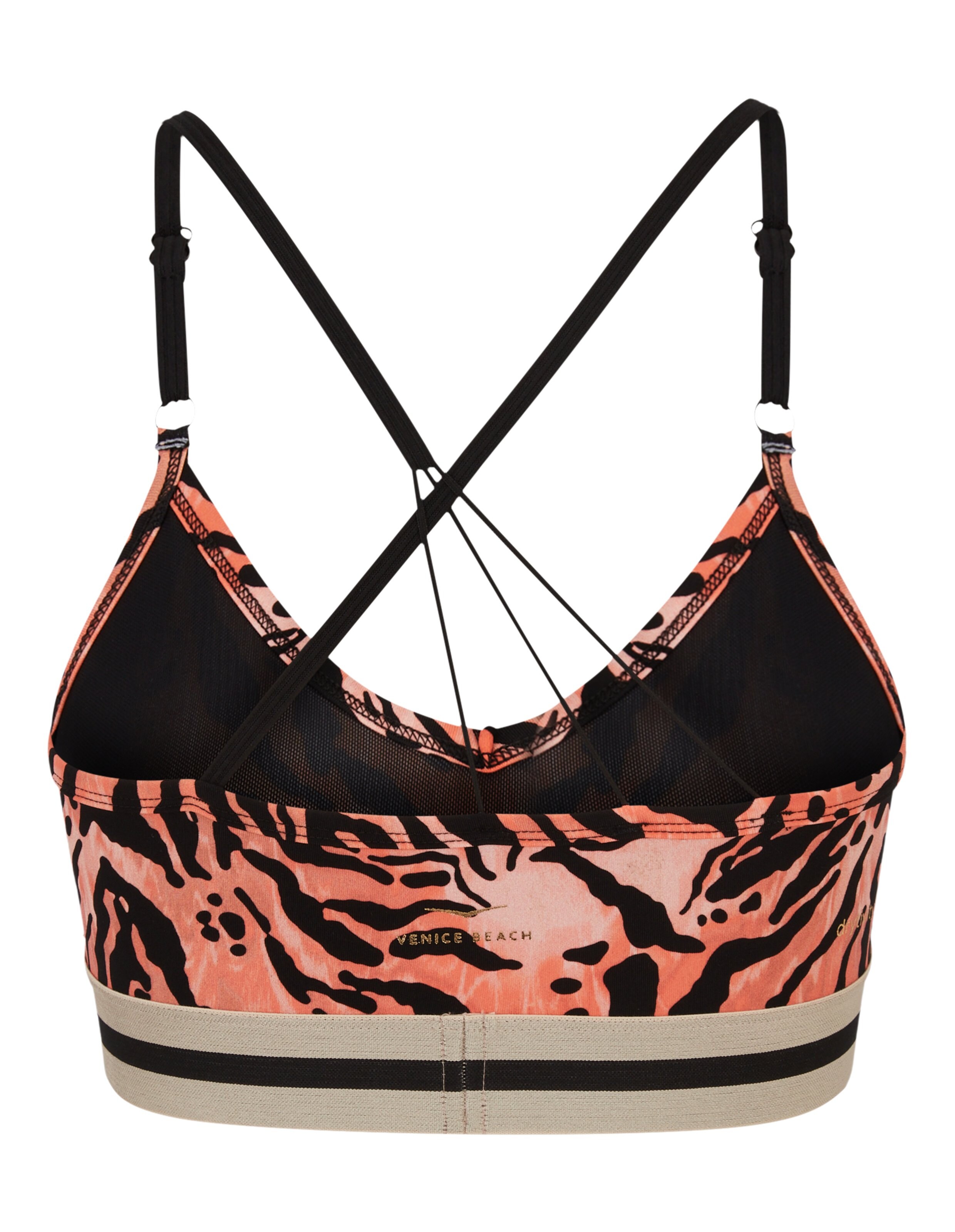 Venice Beach Sport-BH mit orangefarbenem Tigerprint und schwarzen überkreuzten Trägern.