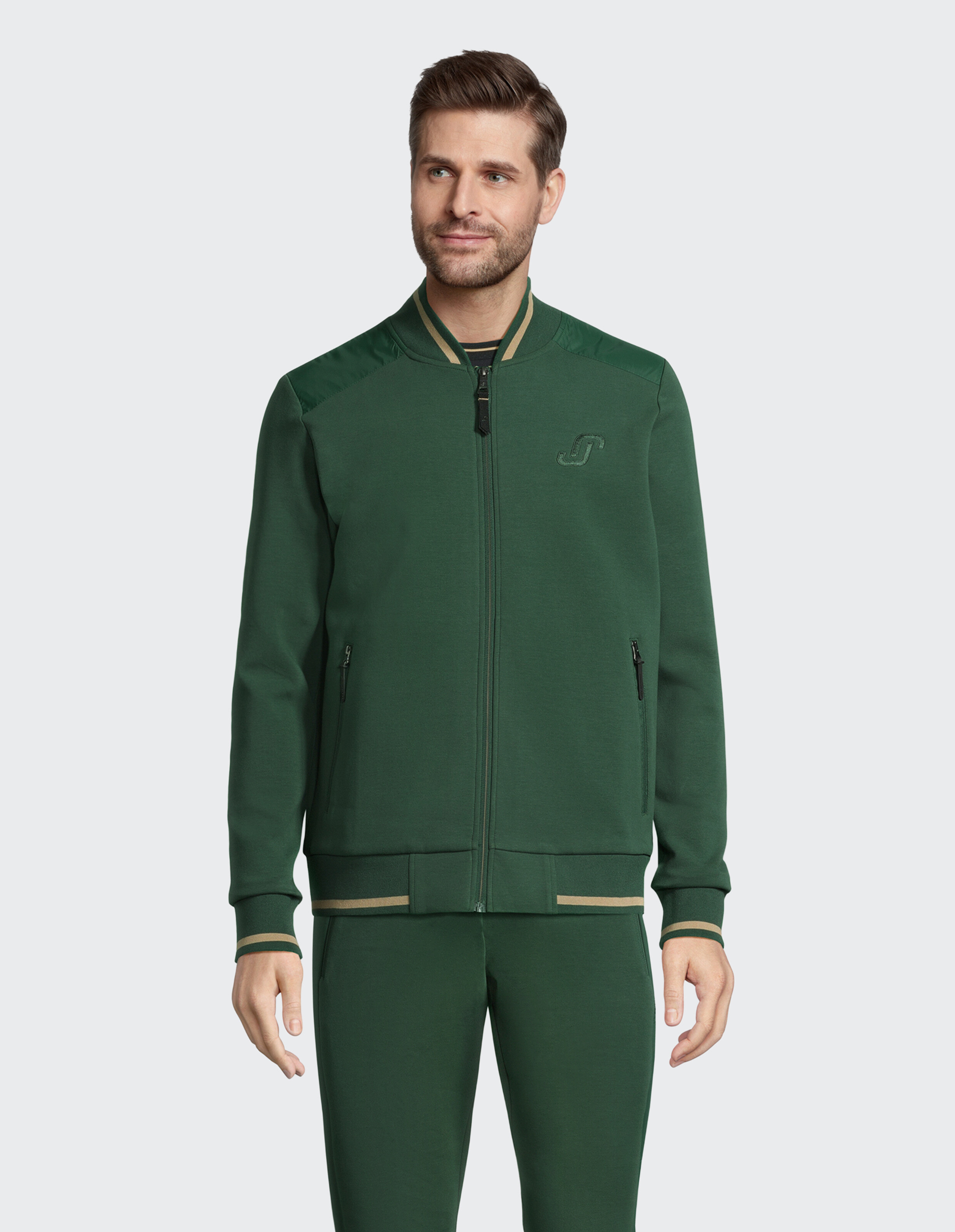 Grüne Herrenjacke mit Reißverschluss, kontrastierendem Kragen und stilvollem Design.